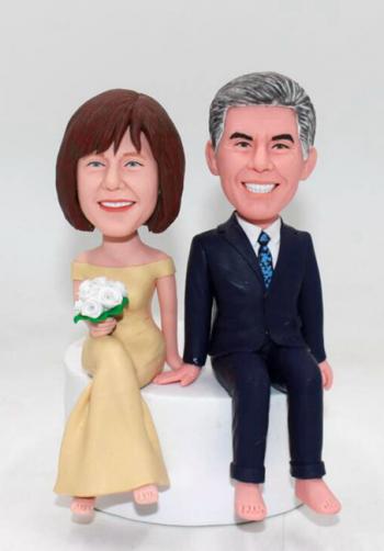 Personalized wedding cake topper Sitting on the cake