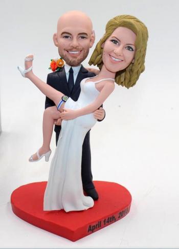 Groom carrying bride country wedding bobbleheads cake topper