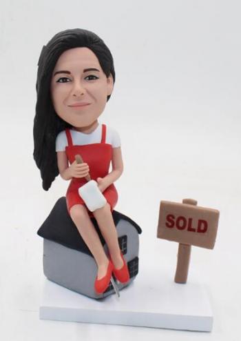 Realtor bobblehead-Sitting on house