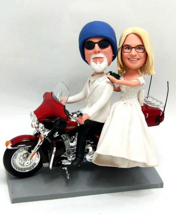 Custom couple bobbleheads on Harley Davidson wedding cake topper